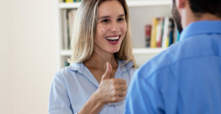 Laughing businesswoman talking with businessman